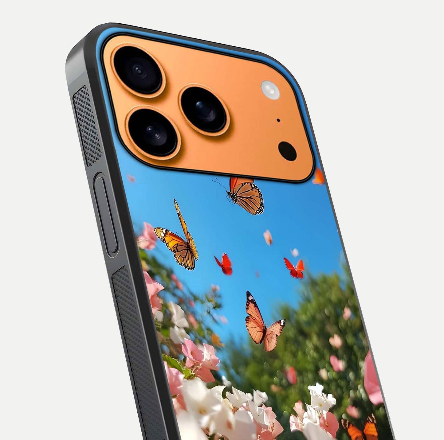 Butterflies in Bloom Sky Glass Case for iPhone 17 Pro Max close-up shot showing wings, petal reflections, and soft hues