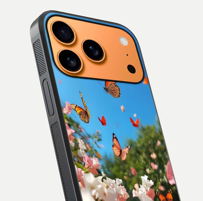 Butterflies in Bloom Sky Glass Case for iPhone 17 Pro Max close-up shot showing wings, petal reflections, and soft hues