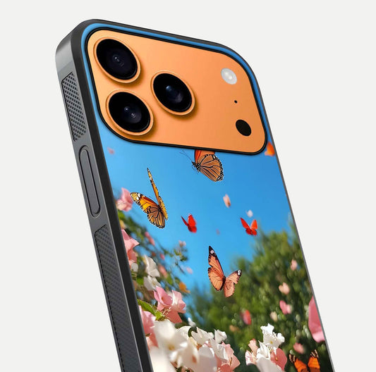 Butterflies in Bloom Sky Glass Case for iPhone 17 Pro Max close-up shot showing wings, petal reflections, and soft hues