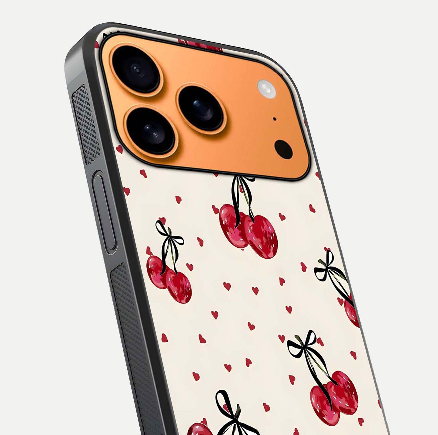 Cherry Heart Bow Glass Case for iPhone 17 Pro Max close-up highlighting small bows, cherry red tones, and gloss shine