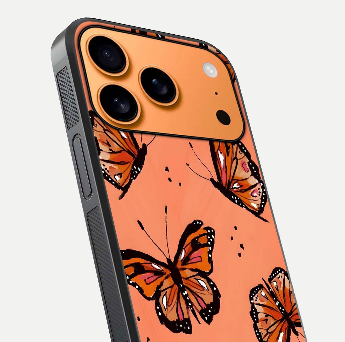 Coral Wing Butterfly Glass Case for iPhone 17 Pro Max close-up highlighting wing pattern, coral tones, and reflection shine