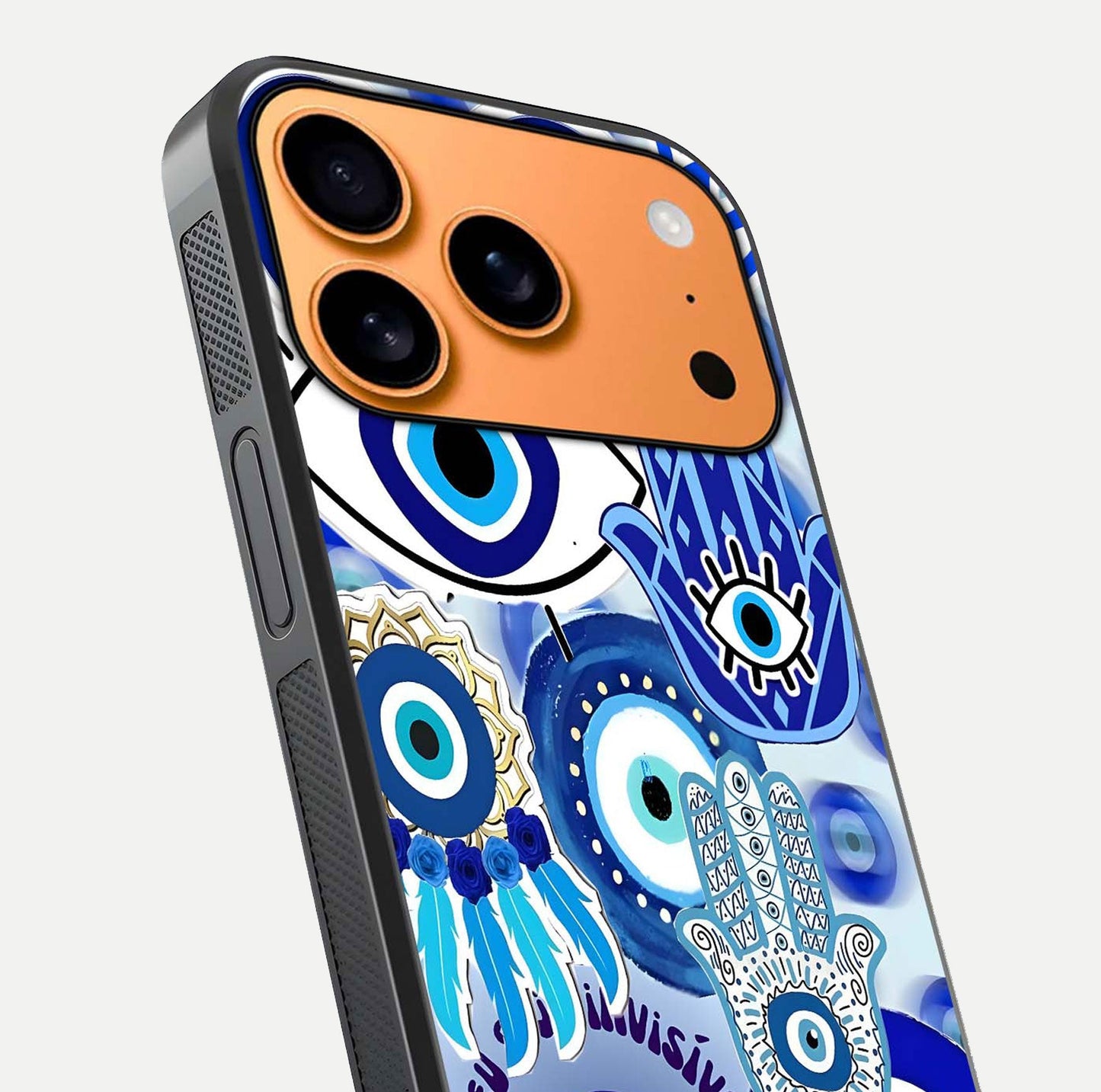 Evil Eyes Dream Glass Case for iPhone 17 Pro Max close-up highlighting evil-eye charm detail and light reflection on glass