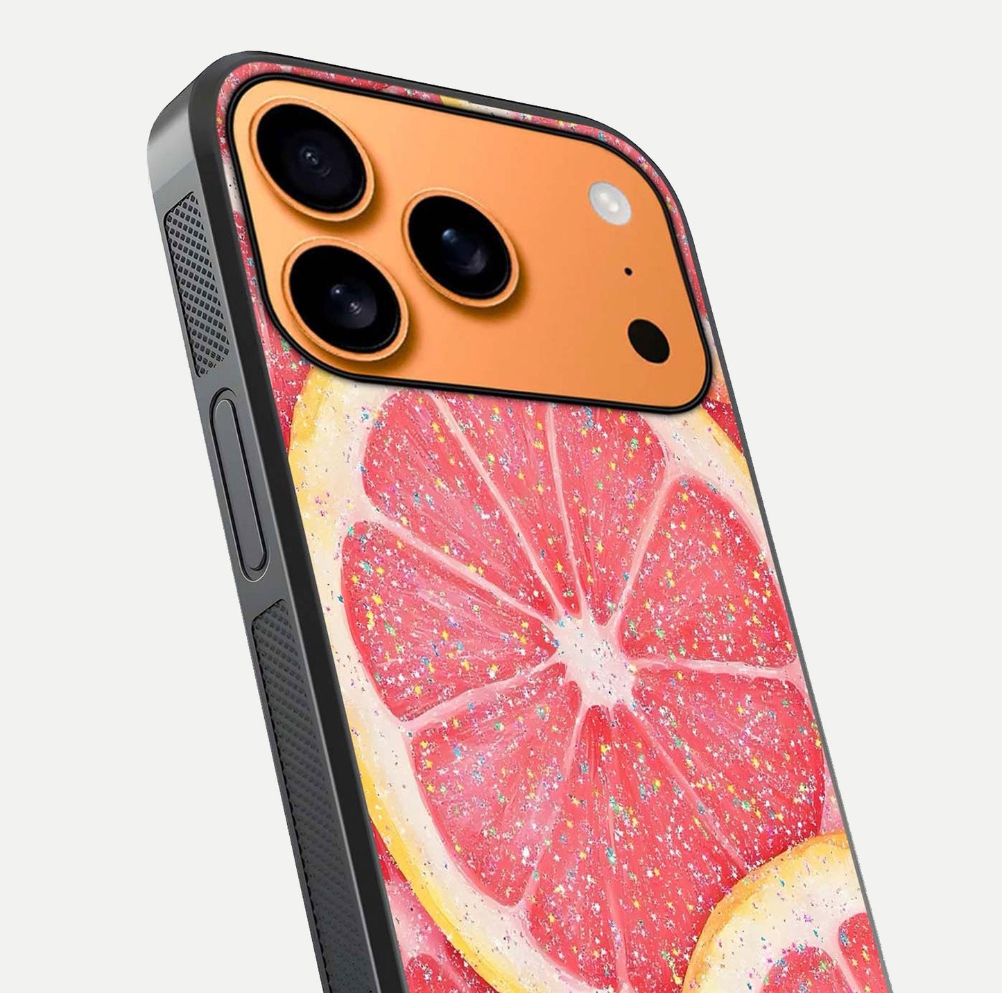 Glitter Grapefruit Glass Case for iPhone 17 Pro Max close-up angled shot showing fruit texture and glitter reflection