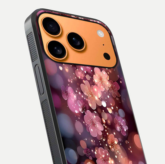 Glowing Petal Bliss Glass Case for iPhone 17 Pro Max close-up angled shot showing petal glow, color depth, and reflection shine
