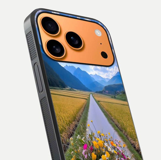 Golden Field Journey Glass Case for iPhone 17 Pro Max close-up angled shot showing sunlight tones and reflection clarity
