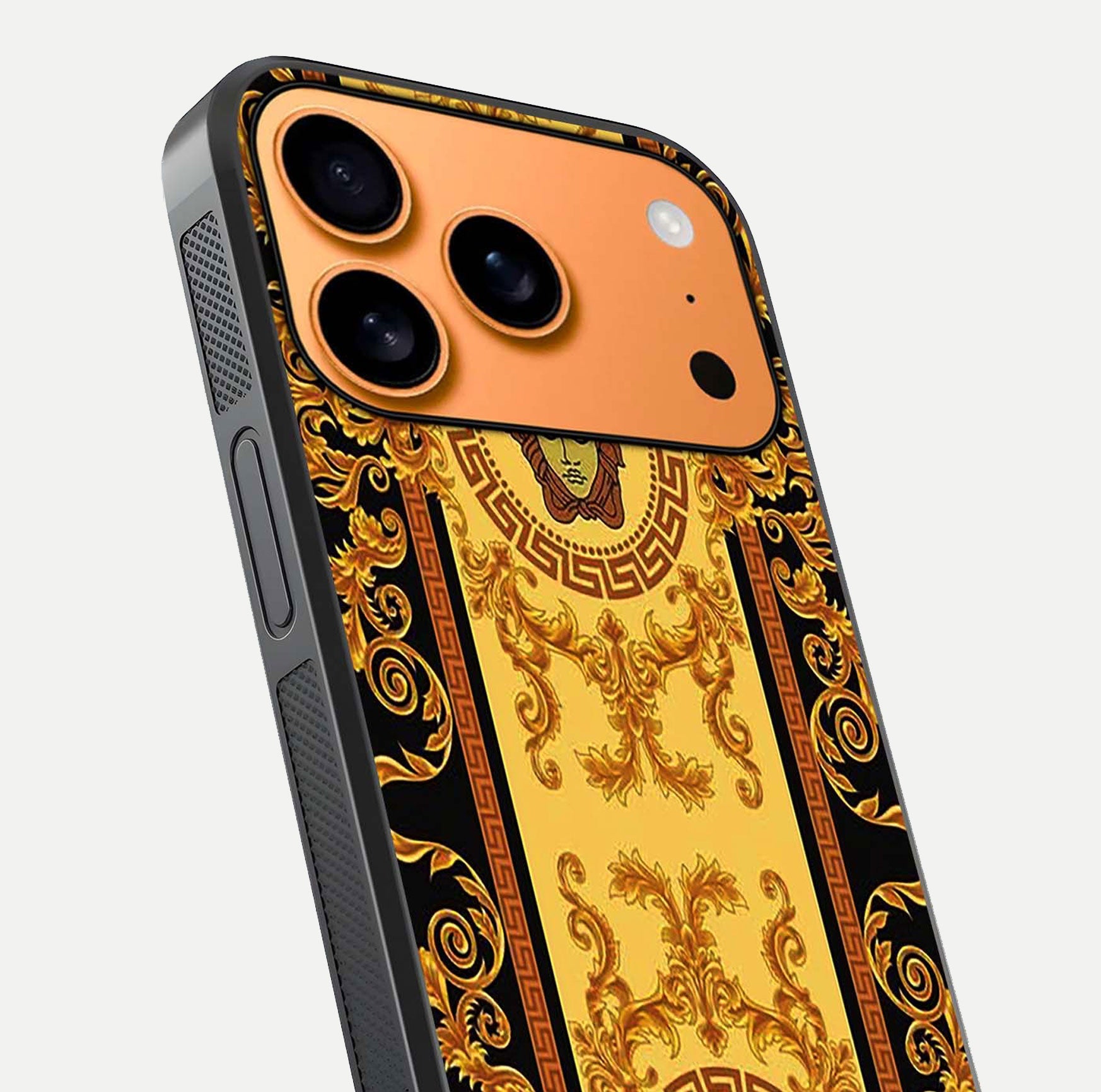 Golden Royal Heritage Glass Case for iPhone 17 Pro Max close-up angled shot showing intricate design and metallic reflection