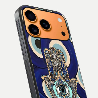 Hamsa Divine Guard Glass Case for iPhone 17 Pro Max close-up angled shot showing detailed palm motif and reflection glow