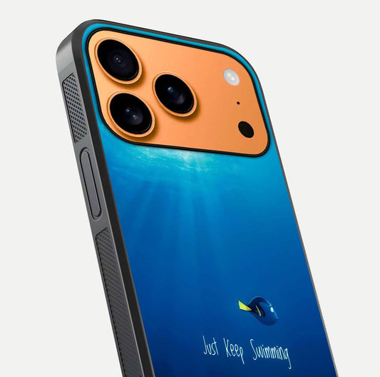 Just Keep Swimming Glass Case for iPhone 17 Pro Max close-up angled shot showing elegant lettering and blue tone reflection