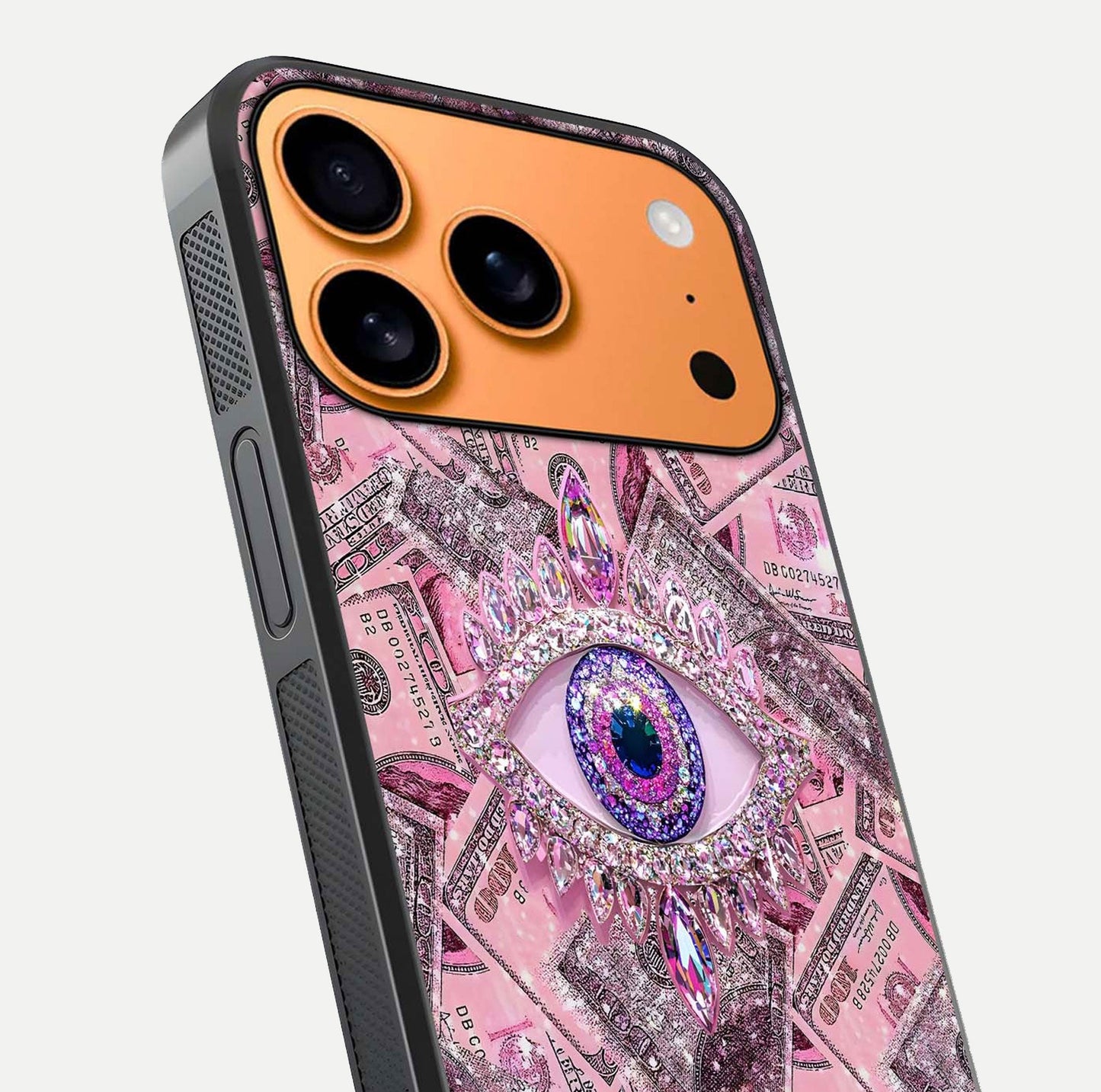 Money Eye Luxe Glass Case for iPhone 17 Pro Max close-up angled shot showing gold detailing and reflection shine
