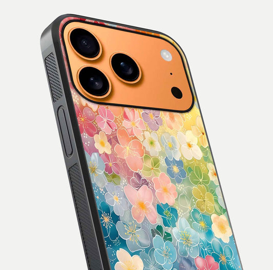 Rainbow Blossom Burst Glass Case for iPhone 17 Pro Max close-up angled shot showing petal colors and reflection