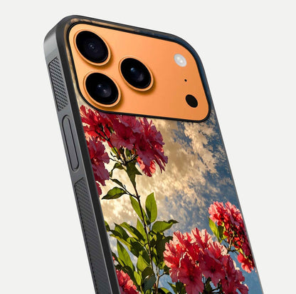 Red Bloom Skies Glass Case for iPhone 17 Pro Max close-up angled shot highlighting detailed blooms and reflection