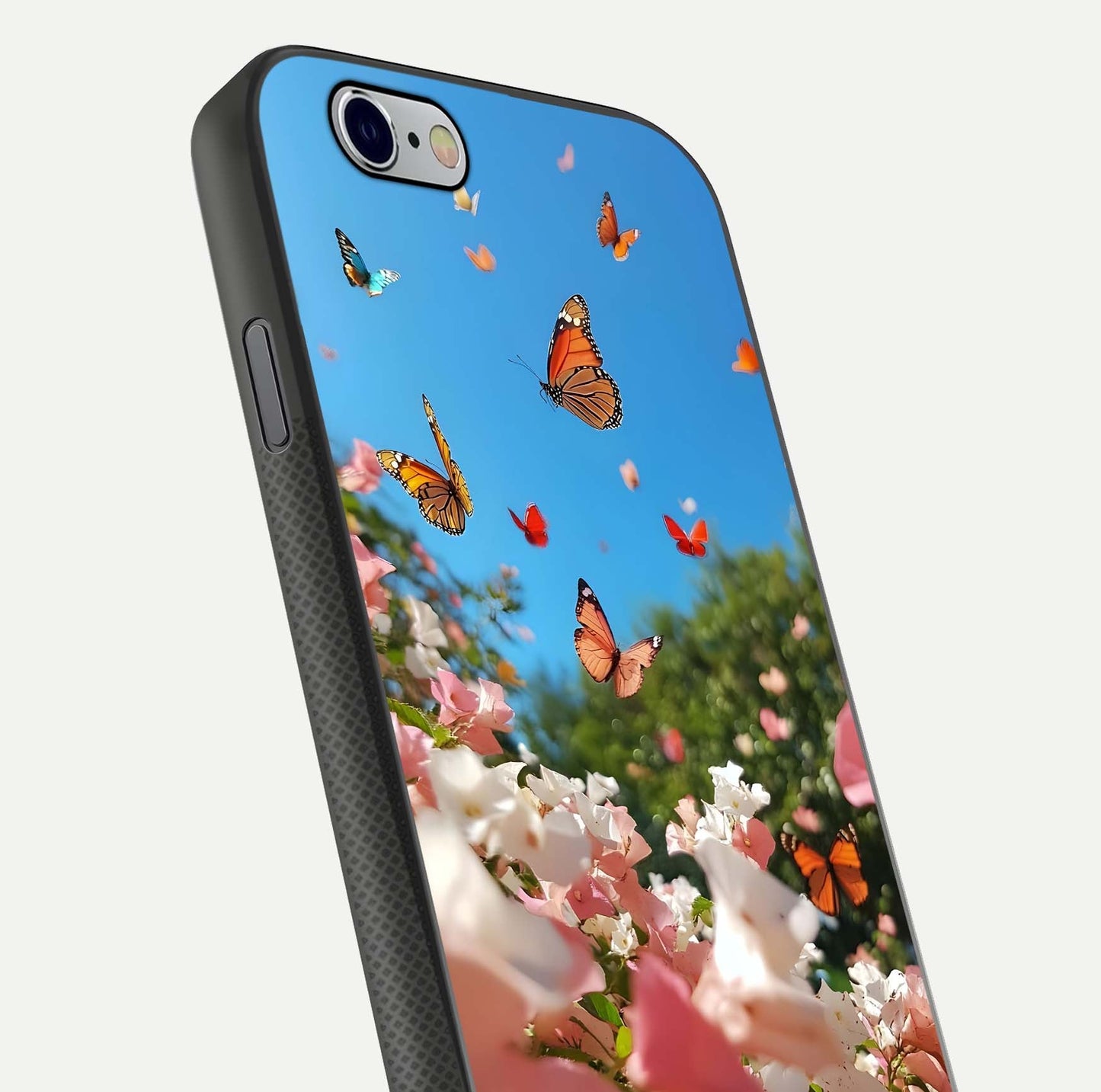 Butterflies in Bloom Sky Glass Case for iPhone 16 Pro close-up shot showing wings, petal reflections, and soft hues