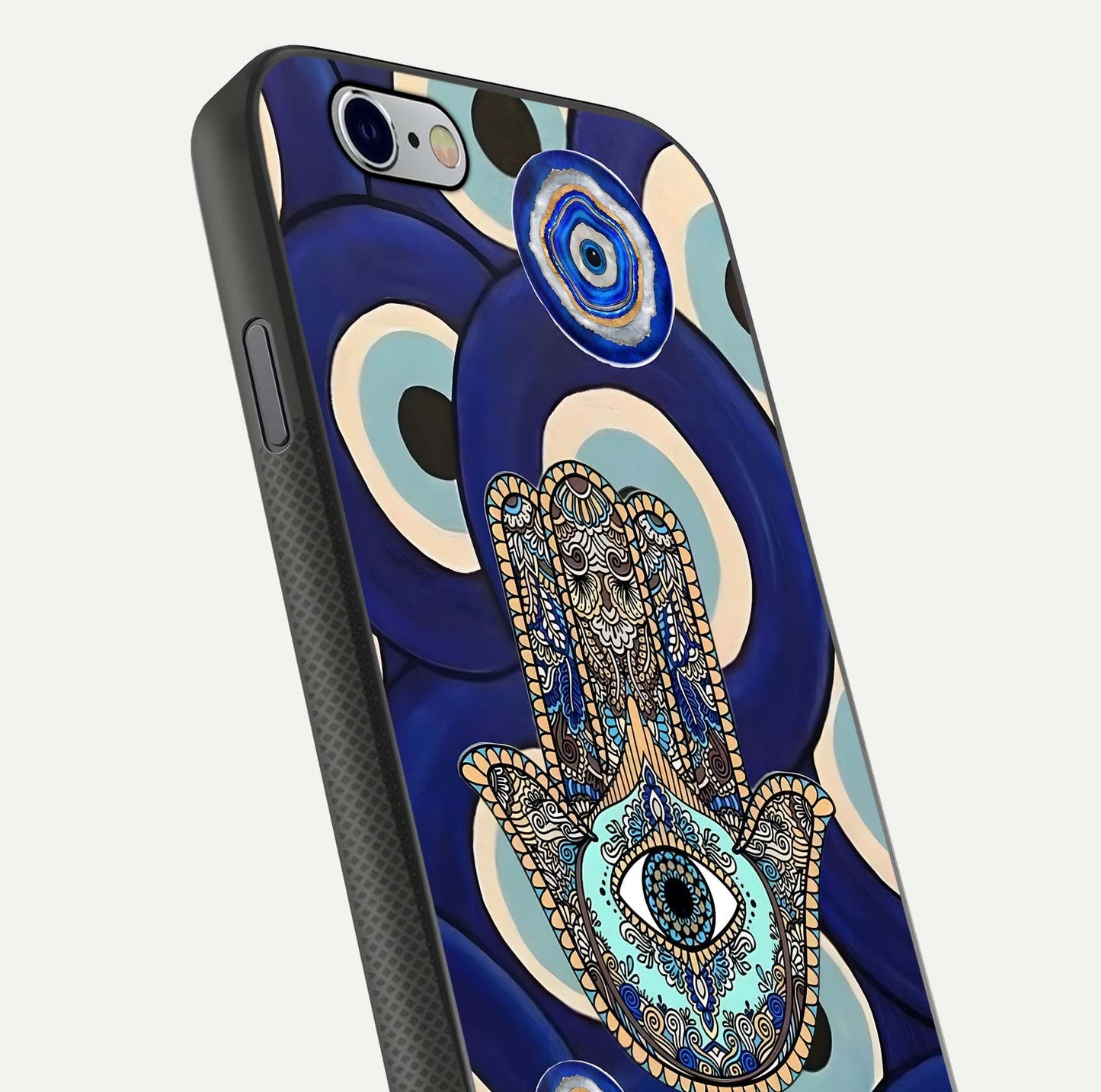 Hamsa Divine Guard Glass Case for iPhone 16 Pro close-up angled shot showing detailed palm motif and reflection glow