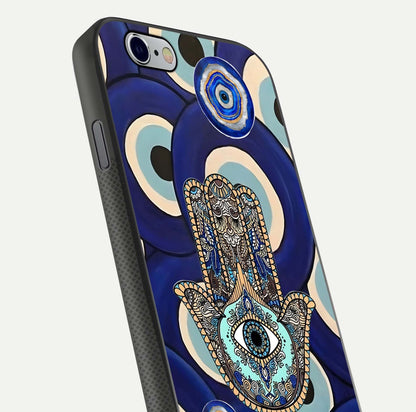 Hamsa Divine Guard Glass Case for iPhone 16 Pro close-up angled shot showing detailed palm motif and reflection glow