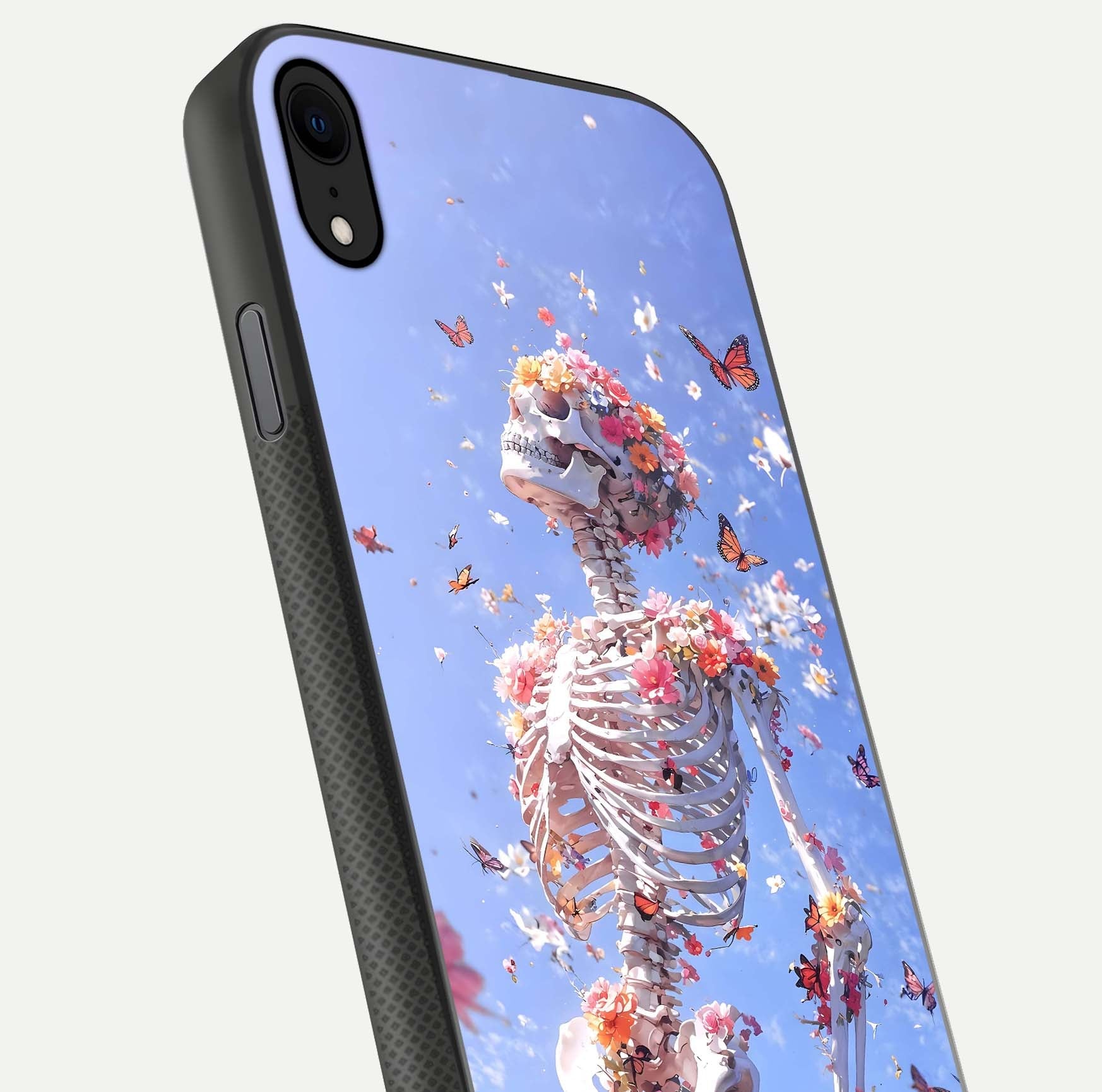 Bloom Beyond Bones Glass Case for iPhone X close-up highlighting unique bone-floral fusion art and reflection