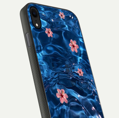 Blooming Water Drift Glass Case for iPhone X close-up angle showing petal details, soft aqua tones, and smooth gloss reflection