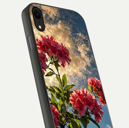 Red Bloom Skies Glass Case for iPhone X close-up angled shot highlighting detailed blooms and reflection
