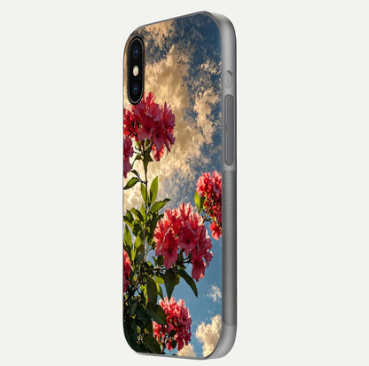 Red Bloom Skies Glass Case for iPhone X side-angle image showing reflection, print clarity, and tone blend