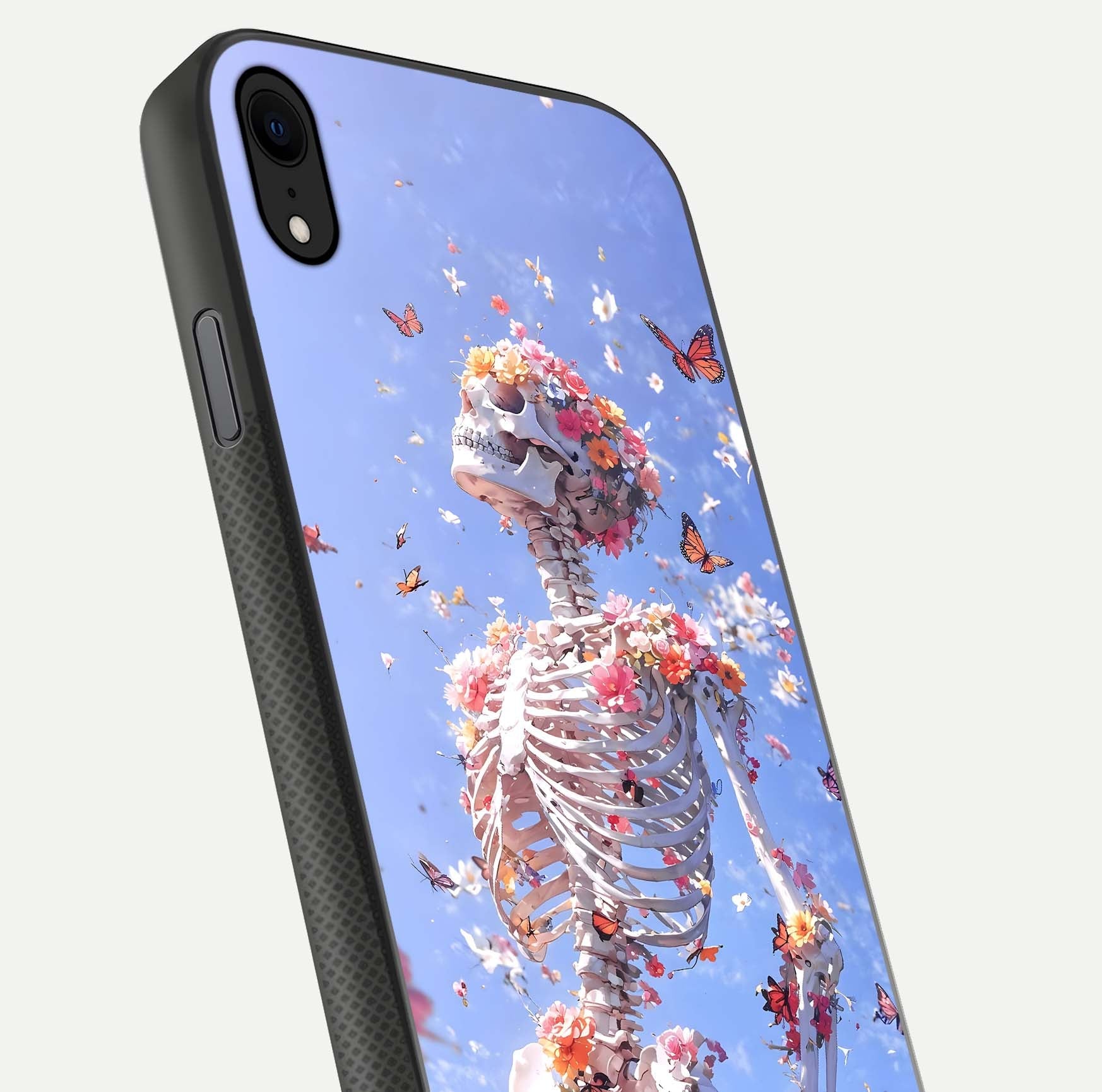 Bloom Beyond Bones Glass Case for iPhone Xr close-up highlighting unique bone-floral fusion art and reflection