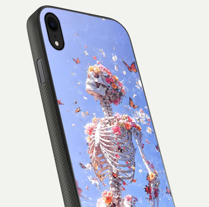 Bloom Beyond Bones Glass Case for iPhone Xr close-up highlighting unique bone-floral fusion art and reflection
