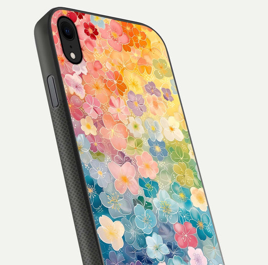 Rainbow Blossom Burst Glass Case for iPhone Xr close-up angled shot showing petal colors and reflection