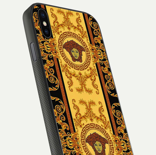 Golden Royal Heritage Glass Case for iPhone Xs close-up angled shot showing intricate design and metallic reflection