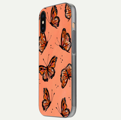 Coral Wing Butterfly Glass Case for iPhone Xs side-angle photo showing reflective finish and smooth edges
