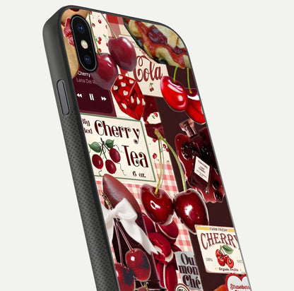 Aesthetic Cherry Tea Glass Case for iPhone 16 Pro close-up angled shot showing detailed cherry artwork, red tones, and gloss reflection